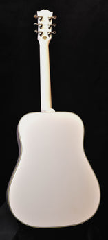 alpine white acoustic guitar with full body shape and headstock