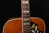 Acoustic guitar neck and upper bout with mother-of-pearl style inlays and pickguard art