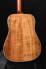 Acoustic guitar back panel with figured wood grain and glossy amber finish