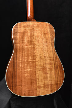 acoustic guitar back panel with figured wood grain and glossy amber finish