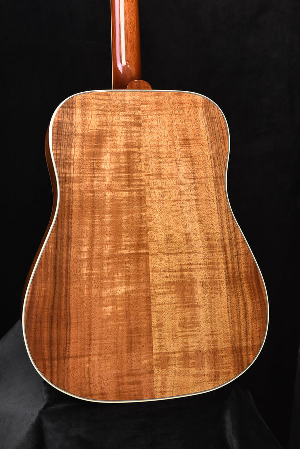 Acoustic guitar back panel with figured wood grain and glossy amber finish
