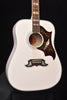 Alpine White acoustic-electric guitar body with dark floral pickguard and rosette soundhole