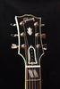 Gibson headstock with Dove graphic and six Grover-style tuning pegs