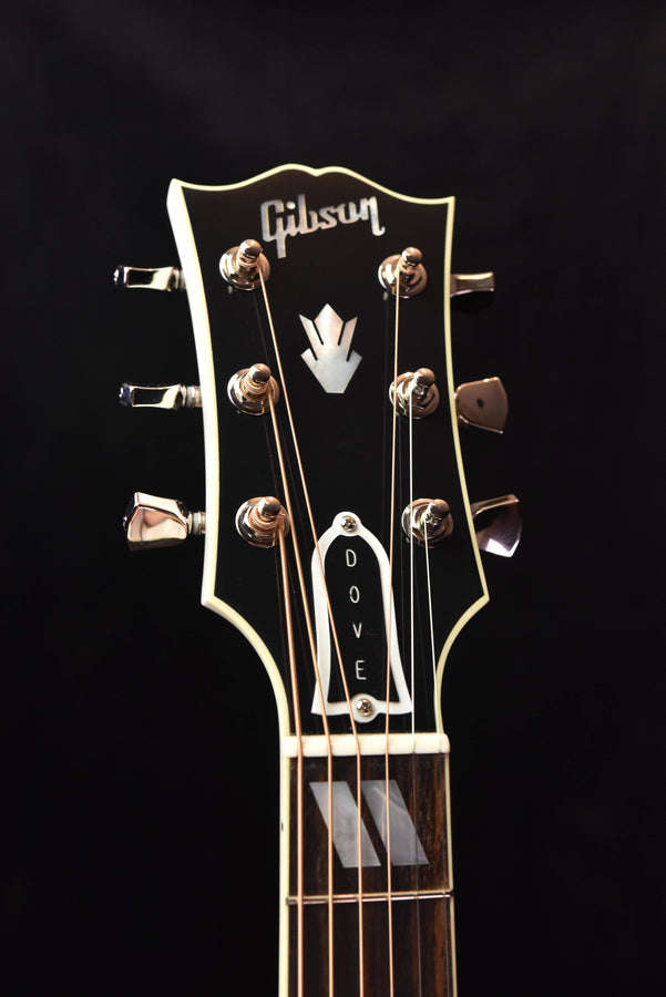 Gibson headstock with Dove graphic and six Grover-style tuning pegs
