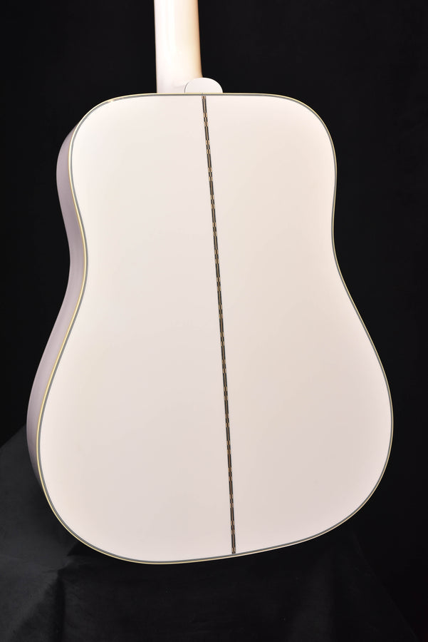 Alpine White glossy acoustic-electric guitar back with central seam and binding border