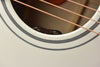 Soundhole rosette with stacked black-and-white inlay and 'tone' marking