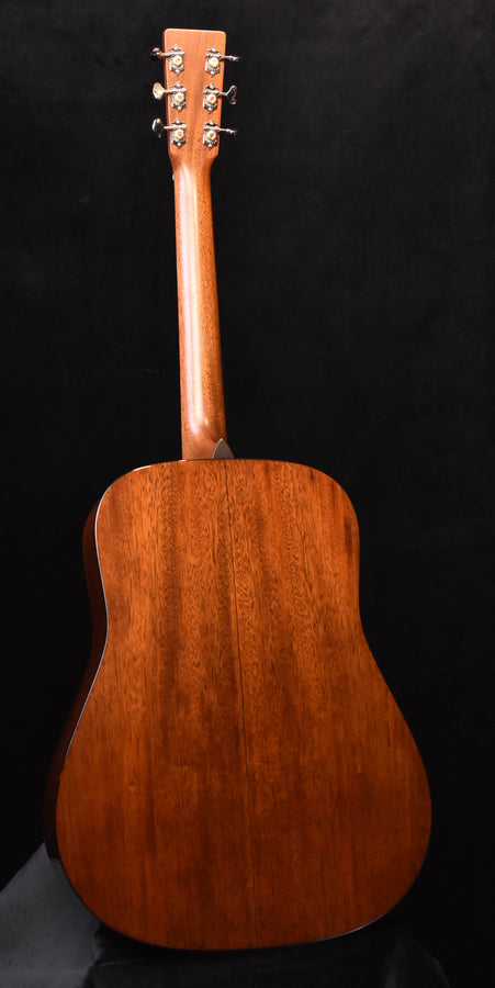 D-shaped acoustic guitar body with carved neck and chrome tuning keys
