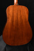 Back of acoustic guitar with rich dark wood grain