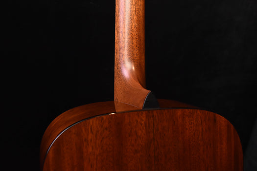 curved shoulder area of acoustic guitar back and neck joint