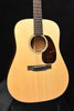 Full view acoustic guitar with light spruce top, sound hole rosette, and pickguard