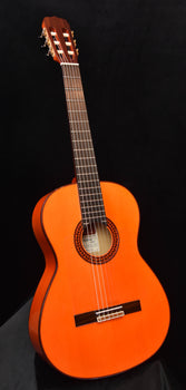 jose ramirez flamenco guitar with orange body and dark soundhole rosette