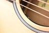 Close-up of guitar body edge and binding near the soundhole