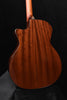 Warm brown acoustic-electric guitar body with glossy wood grain and contoured cutaway