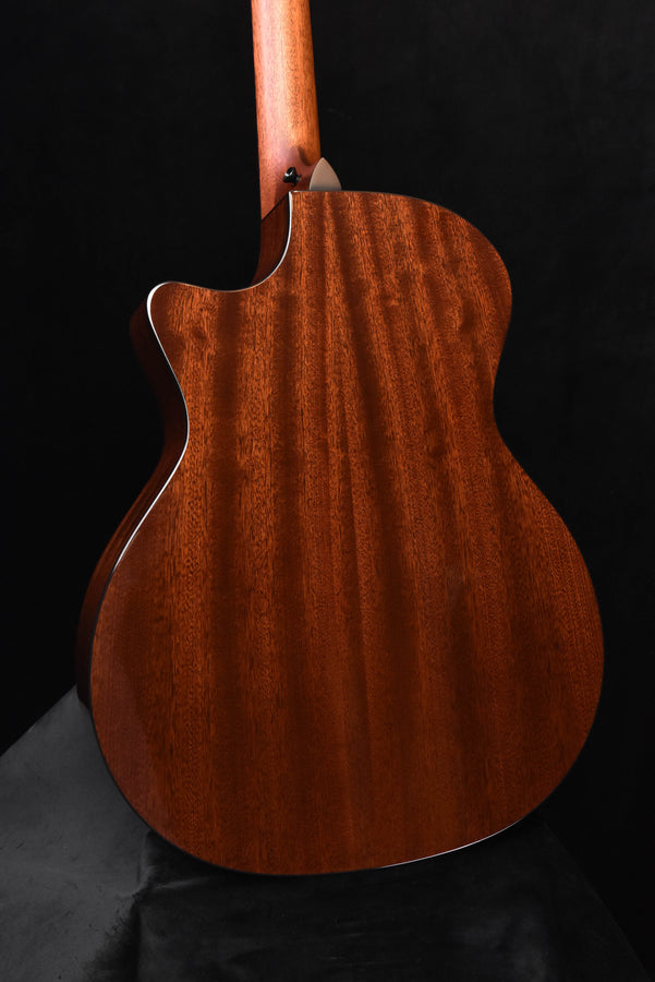 Warm brown acoustic-electric guitar body with glossy wood grain and contoured cutaway