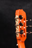 Flamenco guitar headstock with ornate tuning pegs and black knobs