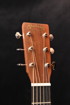 martin acoustic guitar headstock with “martin & co.” logo and tuning pegs