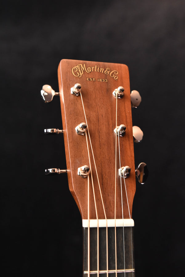 Martin acoustic guitar headstock with “Martin & Co.” logo and tuning pegs