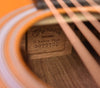 Printed label inside the guitar with “Retro plus” and serial number text