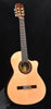 Classical cutaway guitar with spruce top, rosette sound hole, and bridge pickup hardware