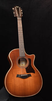 honeyburst 12-string acoustic guitar with sound hole and pickguard, full front view