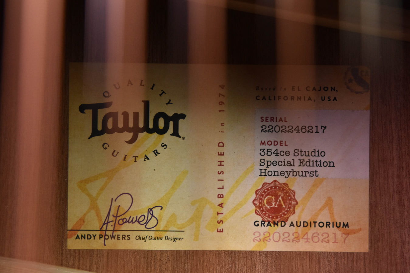 Taylor guitar serial/spec label on wood back, printed details