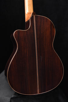 side view of cutaway classical guitar body with binding and central seam line