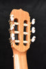 Headstock front with tuning pegs and machine hardware on classical guitar