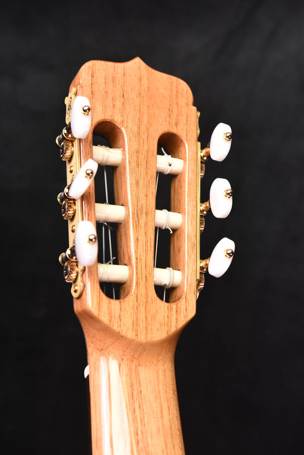 Headstock front with tuning pegs and machine hardware on classical guitar