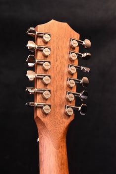 taylor 12-string acoustic guitar headstock with tuning machines, front close-up