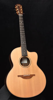 used lowden 32se acoustic guitar with natural wood body and round soundhole