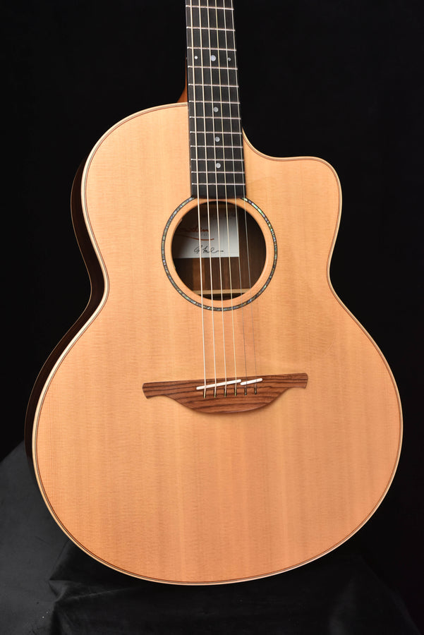 Used Lowden 32SE front view guitar with natural top and decorative rosette