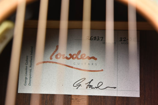 lowden guitars warranty label with serial number and signature text