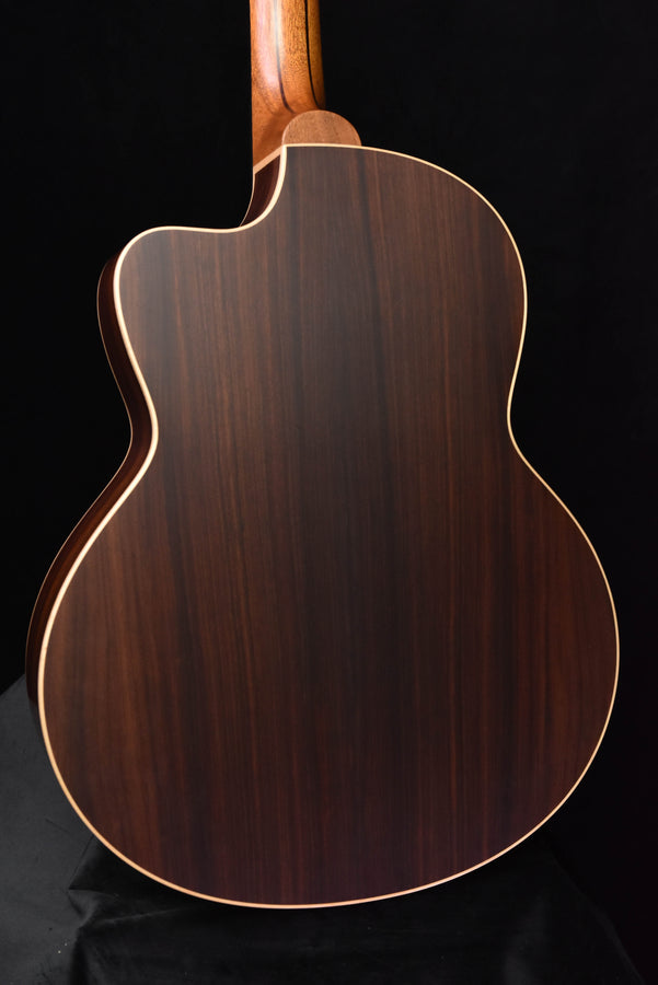 Used Lowden 32SE guitar body from angle with dark wood finish and cream binding