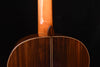 Classical guitar neck joint and upper bout, close-up of wood grain.