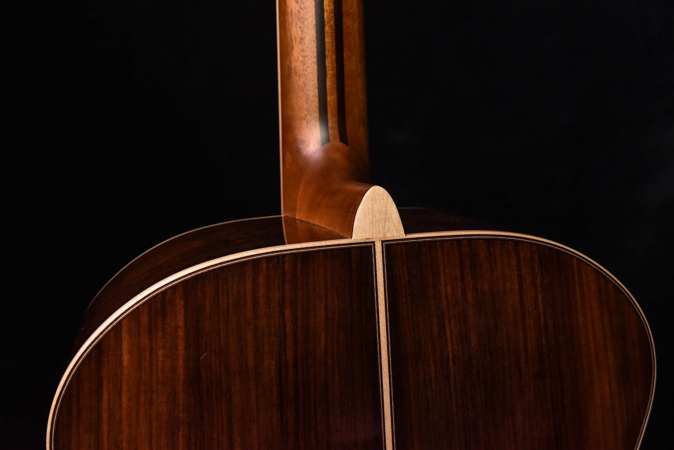 Yamaha acoustic guitar neck joint over back, dark wood with binding