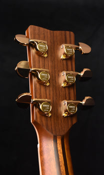 yamaha acoustic guitar headstock, gold-colored tuning machines and yamaha badge