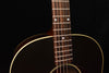 Acoustic guitar neck with frets and headstock-to-body binding detail