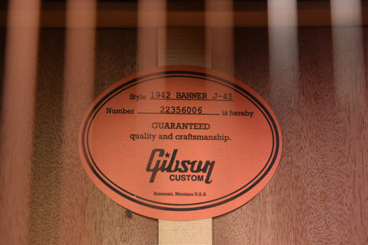 gibson custom warranty label on acoustic guitar wood block