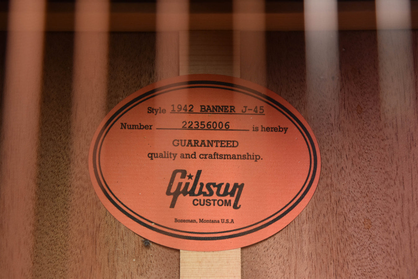 Gibson Custom warranty label on acoustic guitar wood block