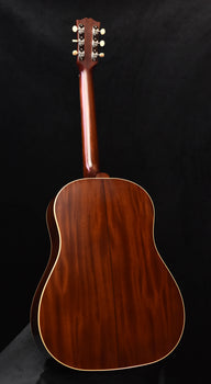 acoustic guitar back in warm wood tone with gold edge binding