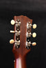 Acoustic guitar headstock with chrome tuners and Gibson branding