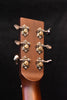 Acoustic guitar headstock with six tuning pegs and ornate metal tuning gears
