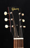 J-45 acoustic guitar headstock with Gibson logo and six tuners, white knobs