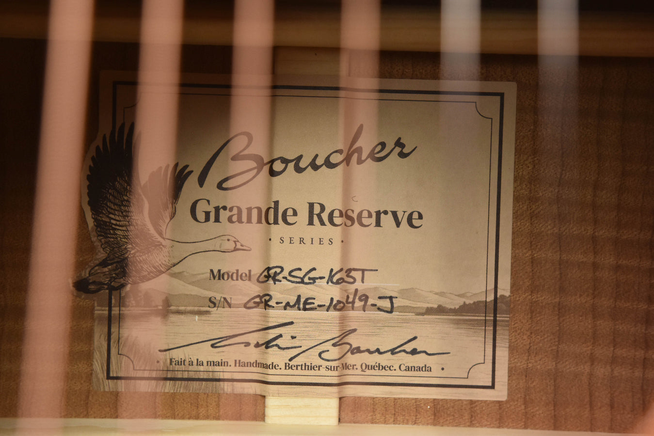 Grand Reserve series label on acoustic guitar case backing with model information