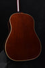 J-45 acoustic guitar back view with rich dark wood grain and white binding