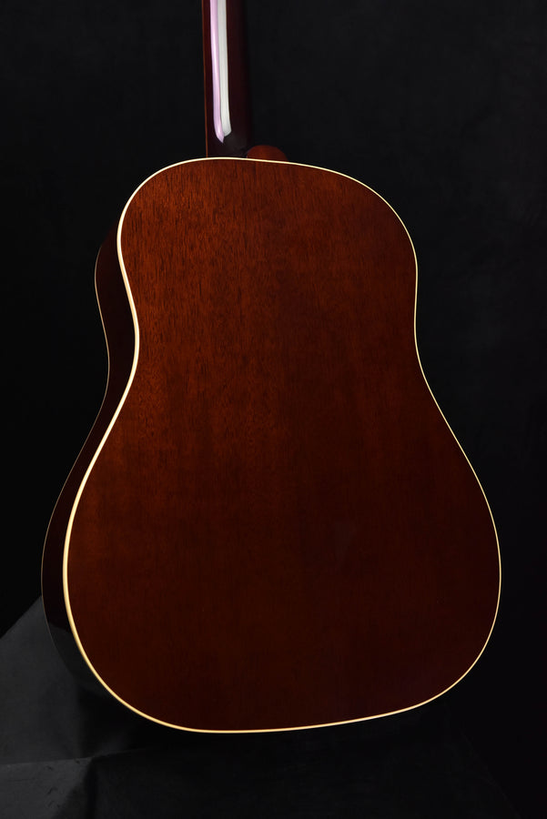 J-45 acoustic guitar back view with rich dark wood grain and white binding
