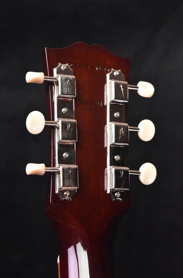 J-45 acoustic guitar headstock with tuners and white knobs, rear view