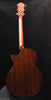Dark wood acoustic guitar back with curved body shape and side binding