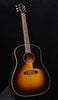 Vintage sunburst acoustic guitar with tortoiseshell pickguard and dot inlays