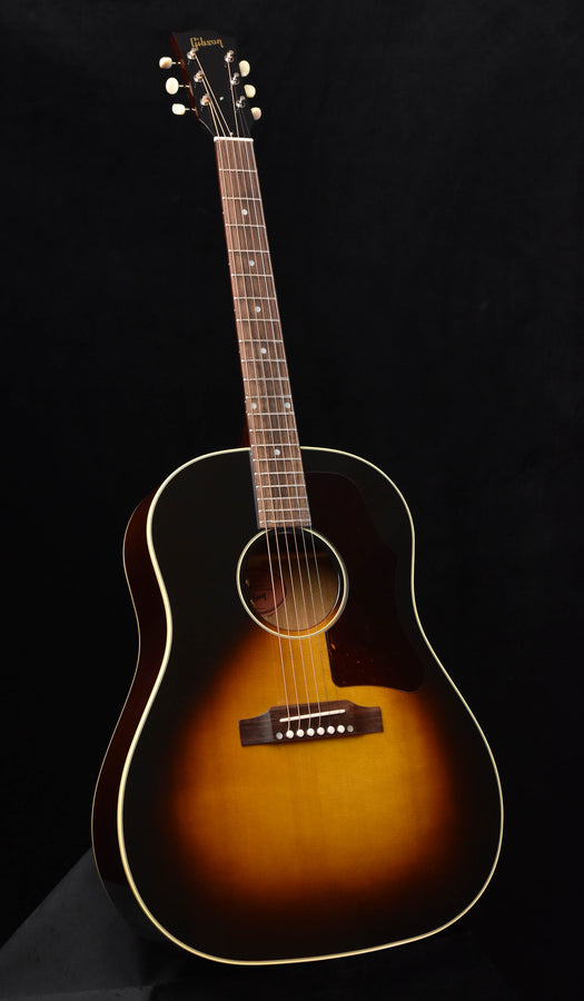 Vintage sunburst acoustic guitar with tortoiseshell pickguard and dot inlays